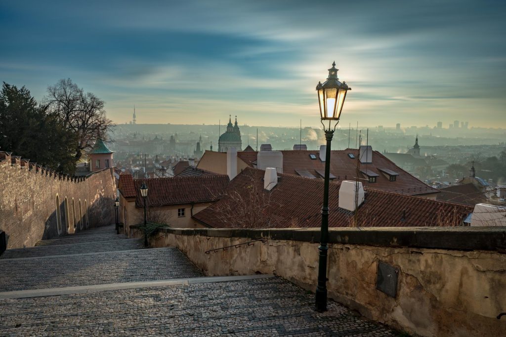 Morning myst over Prague from the steps to the Castle